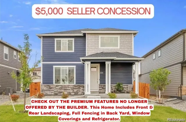 a front view of a building with a garden