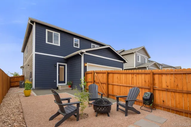a backyard of a house with seating space