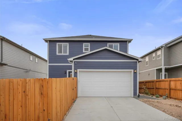a front view of a house with a garage