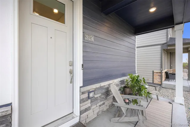a house with a table and chairs in patio