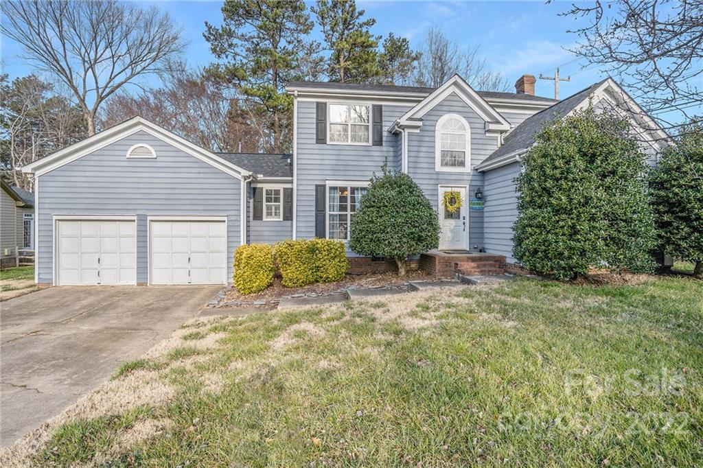 3011 Williams Station Road Matthews, NC 28105 - Photo 2 of 26 a front view of a house with a yard and garage