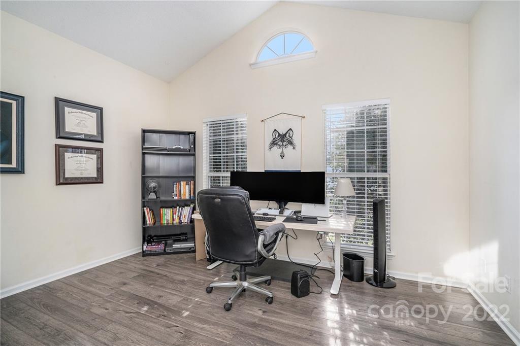 3011 Williams Station Road Matthews, NC 28105 - Photo 4 of 26 a view of a workspace with furniture and wooden floor