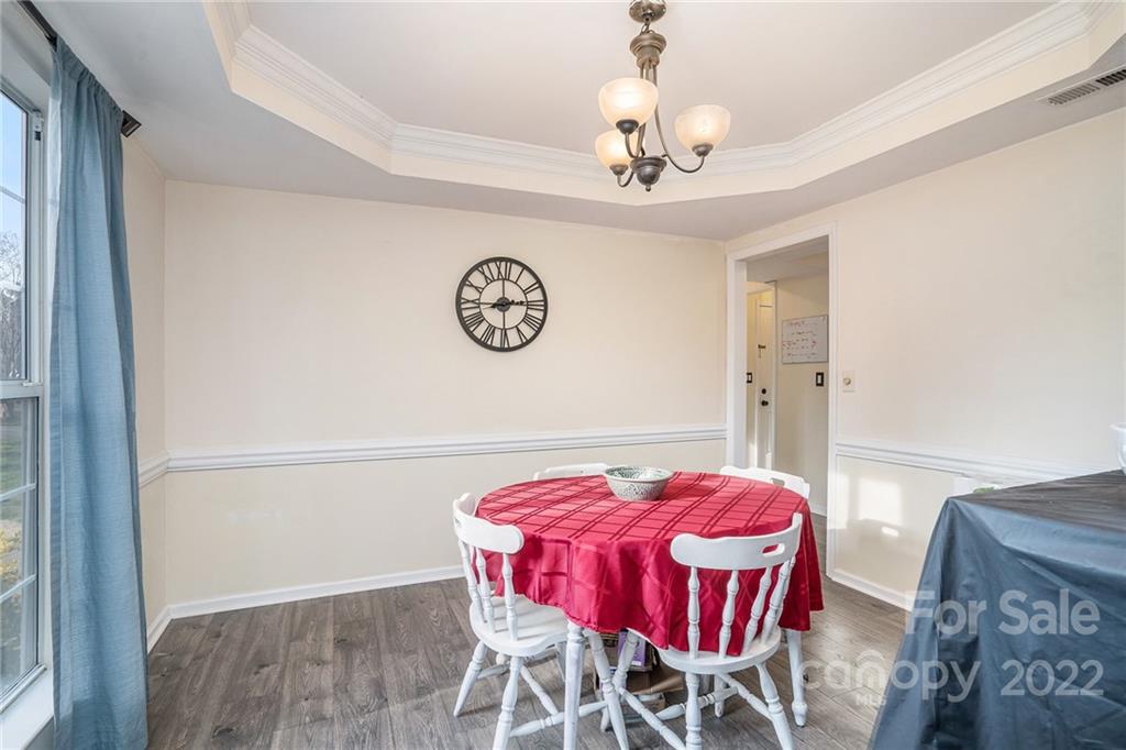 3011 Williams Station Road Matthews, NC 28105 - Photo 5 of 26 a view of a dining room with furniture and chandelier
