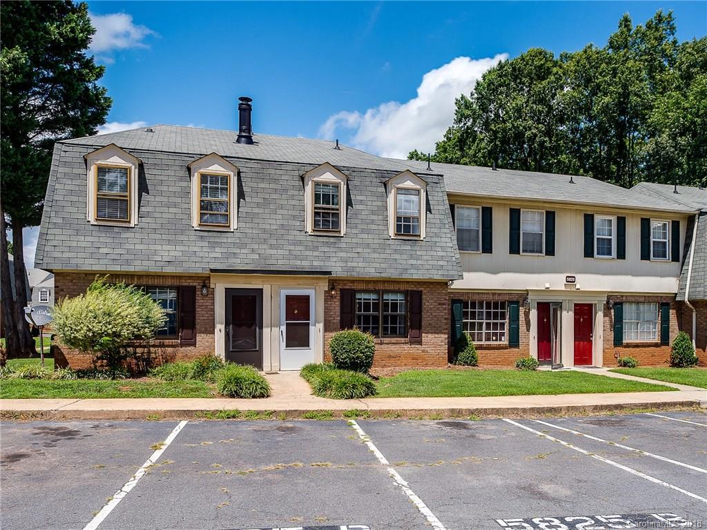 5825 Hunting Ridge Lane, Unit B Charlotte, NC 28212 - Photo 1 of 17 a front view of a building with garden