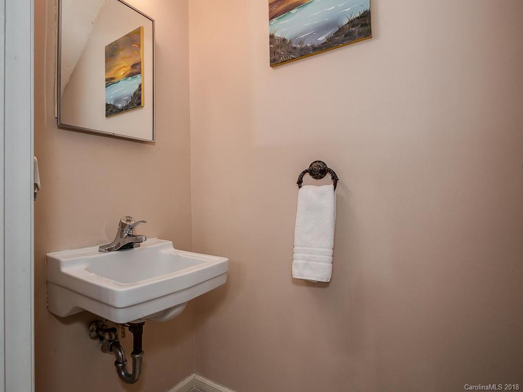 5825 Hunting Ridge Lane, Unit B Charlotte, NC 28212 - Photo 11 of 17 a bathroom with a sink and mirror
