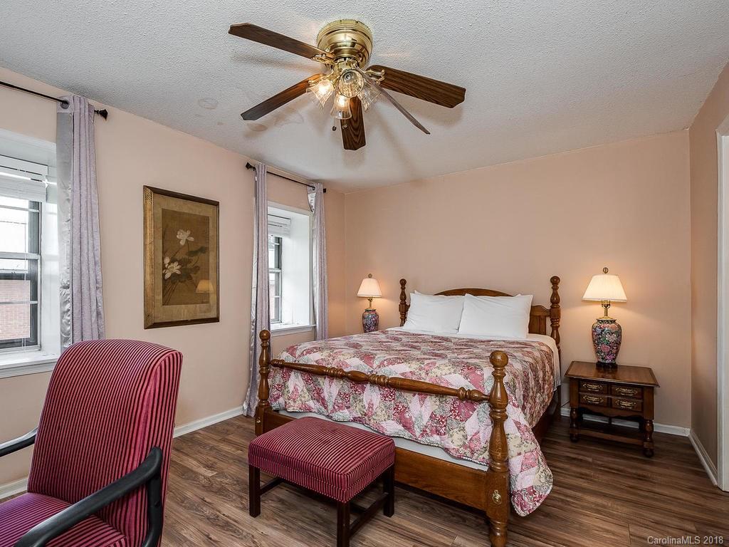 5825 Hunting Ridge Lane, Unit B Charlotte, NC 28212 - Photo 12 of 17 a bedroom with a bed furniture and a window