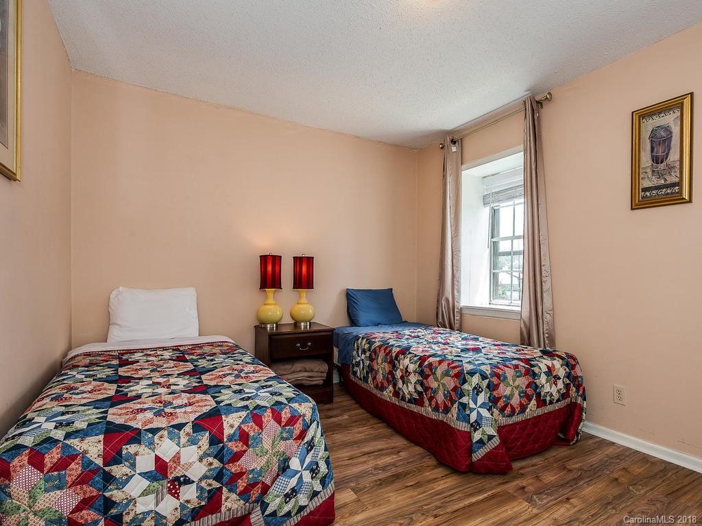 5825 Hunting Ridge Lane, Unit B Charlotte, NC 28212 - Photo 16 of 17 a bedroom with two beds and a window