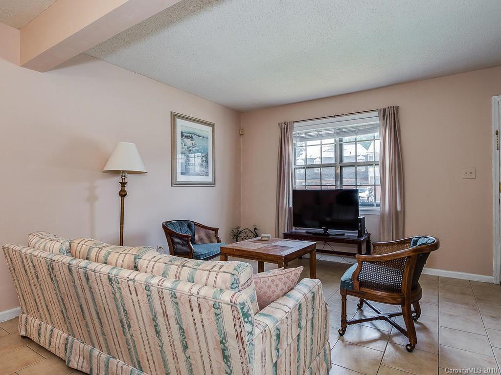 5825 Hunting Ridge Lane, Unit B Charlotte, NC 28212 - Photo 4 of 17 a bedroom with furniture and a window