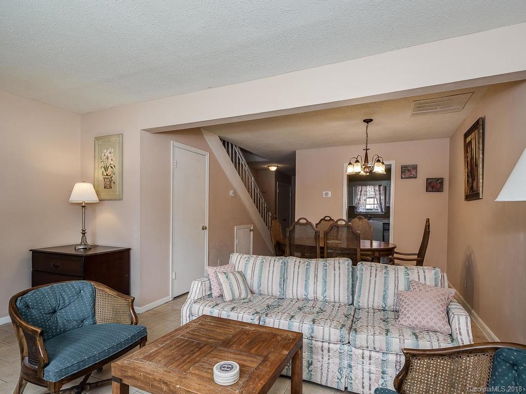 5825 Hunting Ridge Lane, Unit B Charlotte, NC 28212 - Photo 5 of 17 a living room with a couch and a coffee table