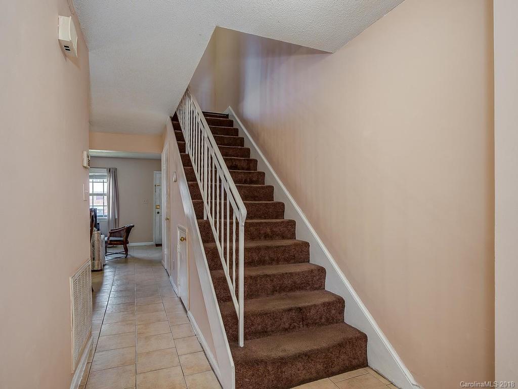 5825 Hunting Ridge Lane, Unit B Charlotte, NC 28212 - Photo 7 of 17 a view of a hallway with stairs
