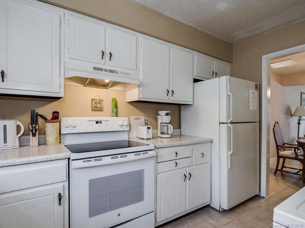 5825 Hunting Ridge Lane, Unit B Charlotte, NC 28212 - Photo 9 of 17 a kitchen with cabinets and appliances