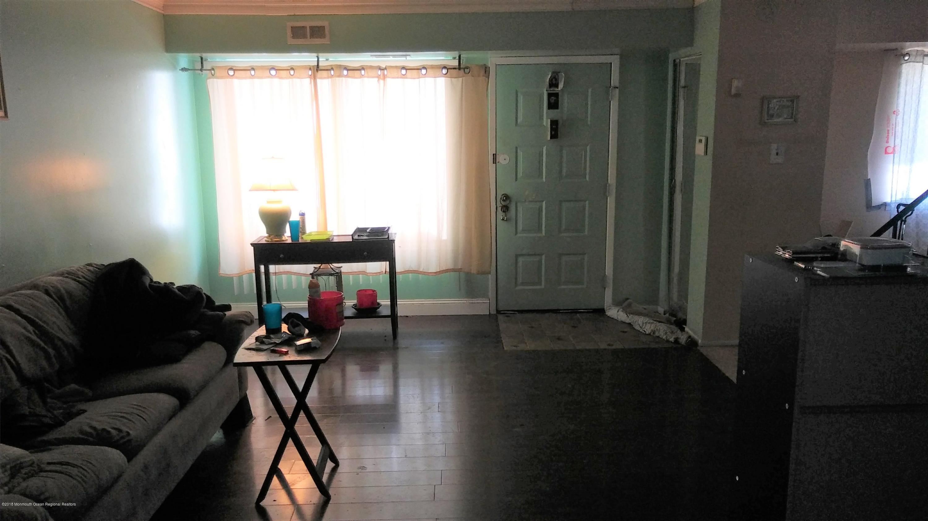1102 Timber Creek Road Lindenwold, NJ 08021 - Photo 2 of 8 a living room with furniture and a window