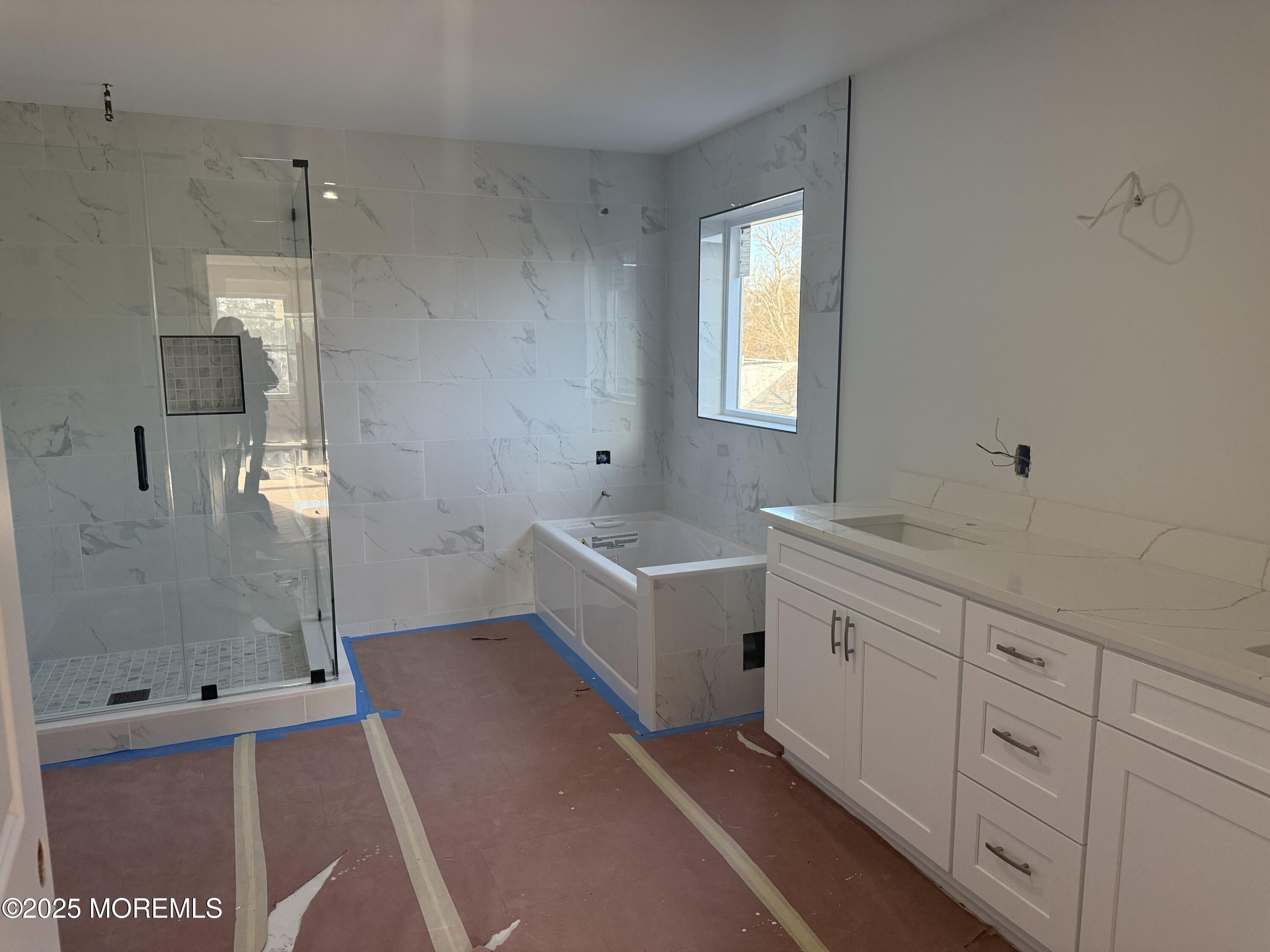 2 B Dey Street Manalapan, NJ 07726 - Photo 14 of 24 a bathroom with a sink a toilet and shower