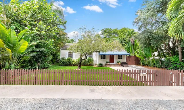 a view of a patio with couches chairs and backyard