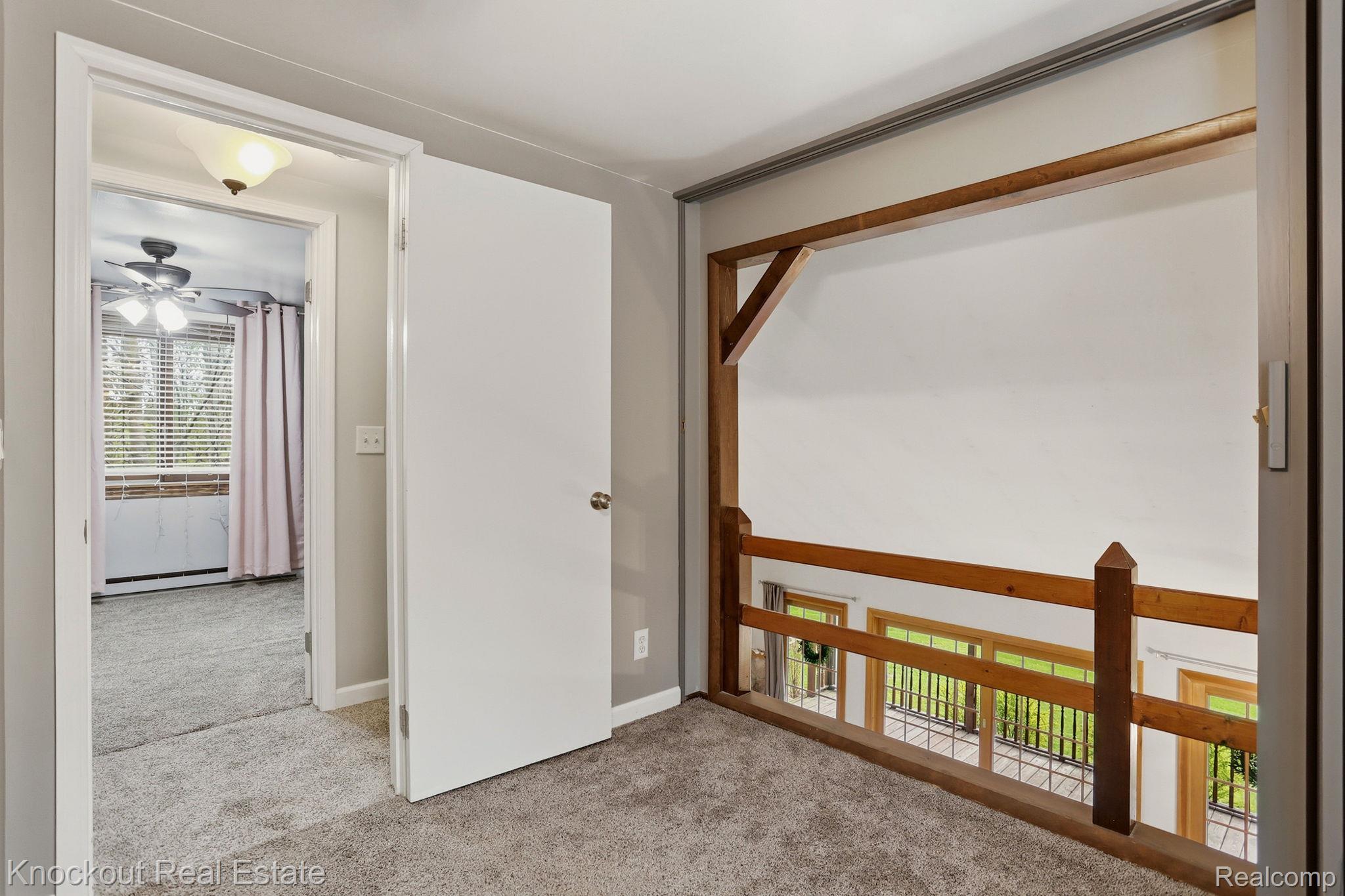 1608 South Pinnebog Road Bad Axe, MI 48413 - Photo 31 of 54 Corridor featuring light carpet and baseboards