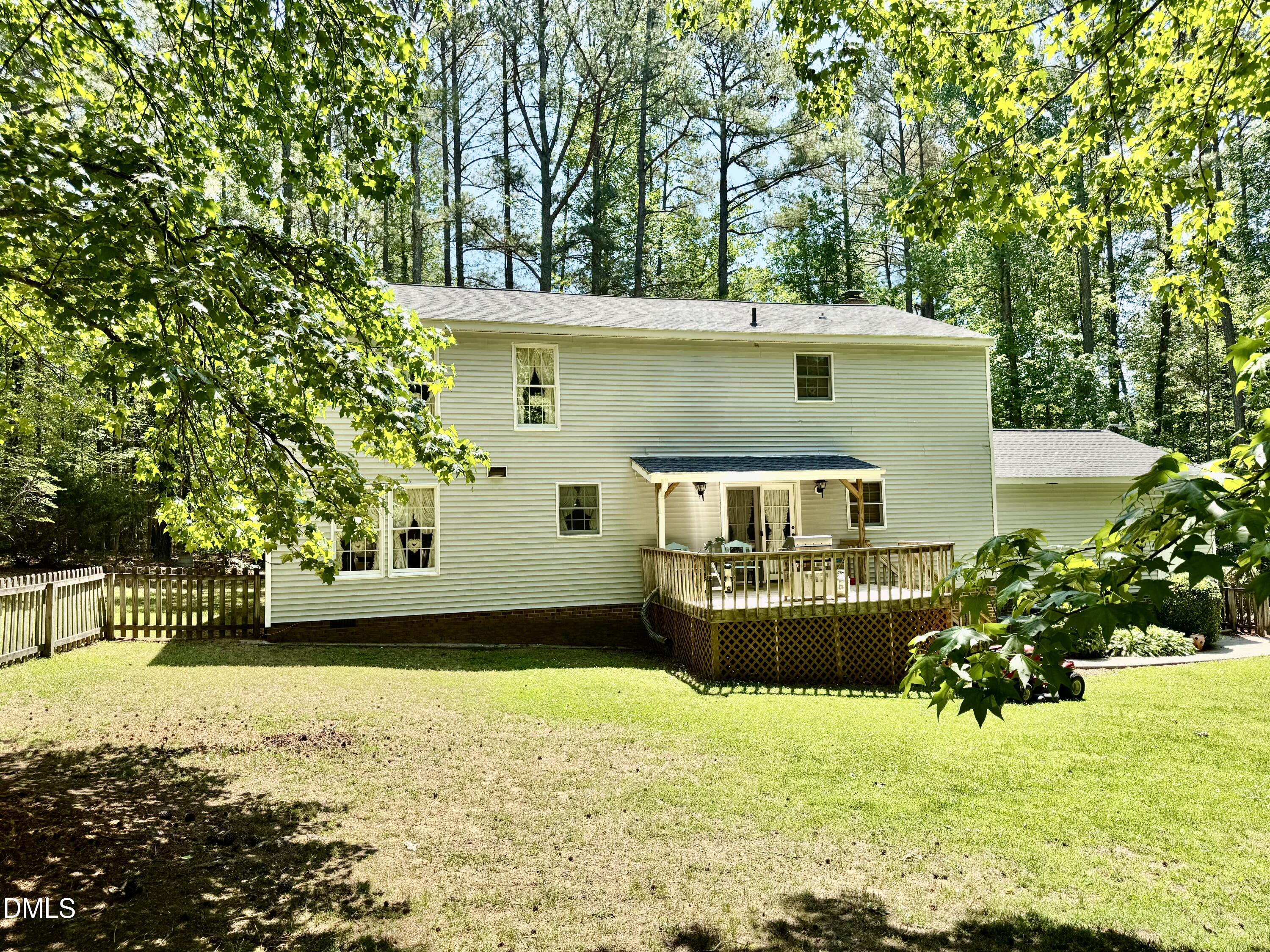 84 Wintergreen Road Henderson, NC 27537 - Photo 6 of 49 a front view of a house with a yard