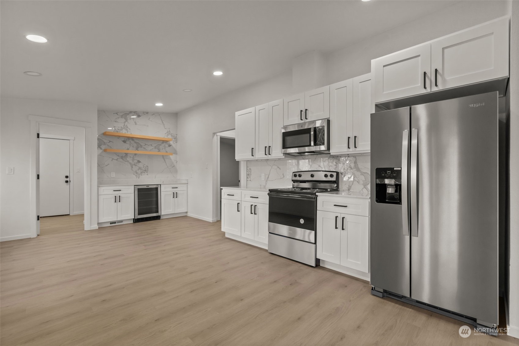 12017 Chappel Road Arlington, WA 98223 - Photo 38 of 40 a kitchen with stainless steel appliances a refrigerator stove and microwave