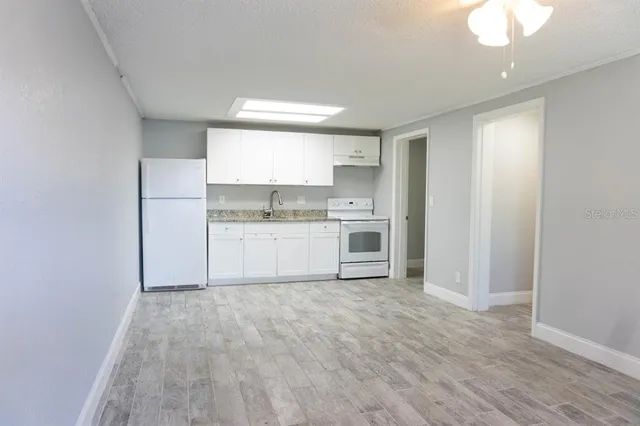 a view of kitchen with wooden floor