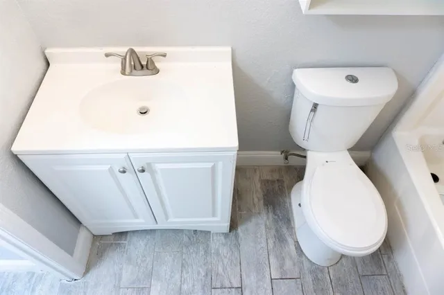 a bathroom with a toilet and a sink