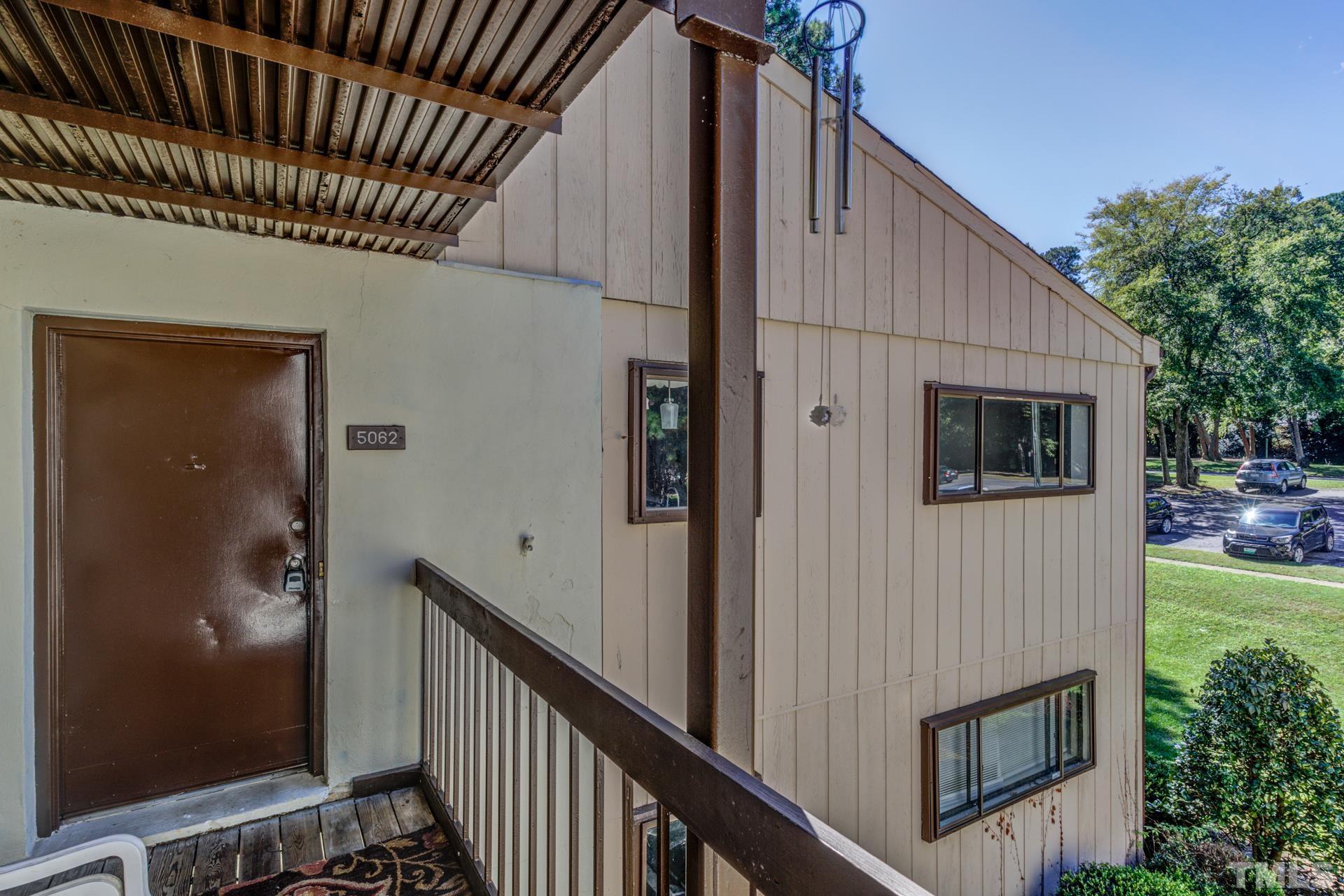 5062 Flint Ridge Place, Unit 5062 Raleigh, NC 27609 - Photo 2 of 23 a view of a house with backyard and deck