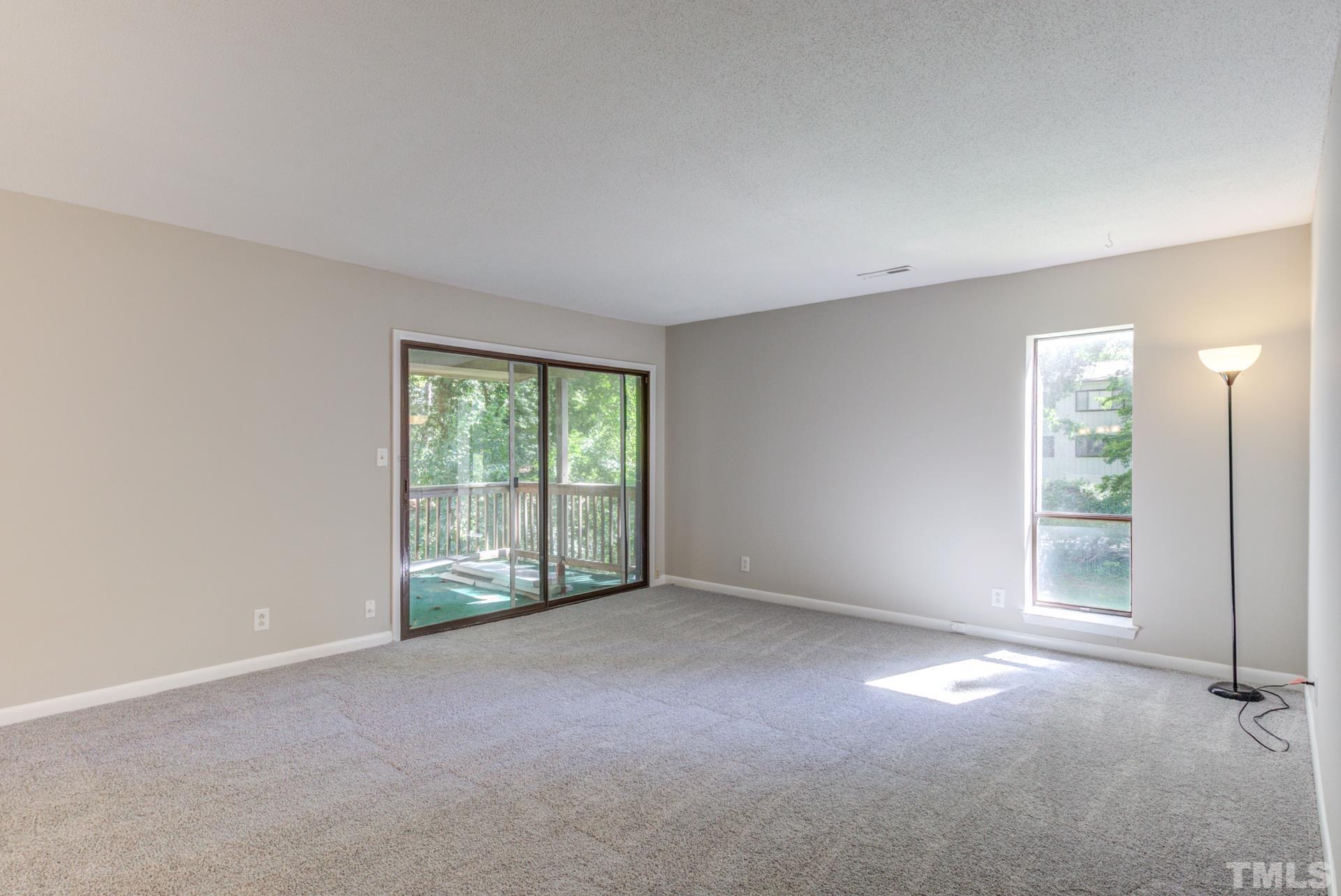 5062 Flint Ridge Place, Unit 5062 Raleigh, NC 27609 - Photo 11 of 23 a view of an empty room with a window