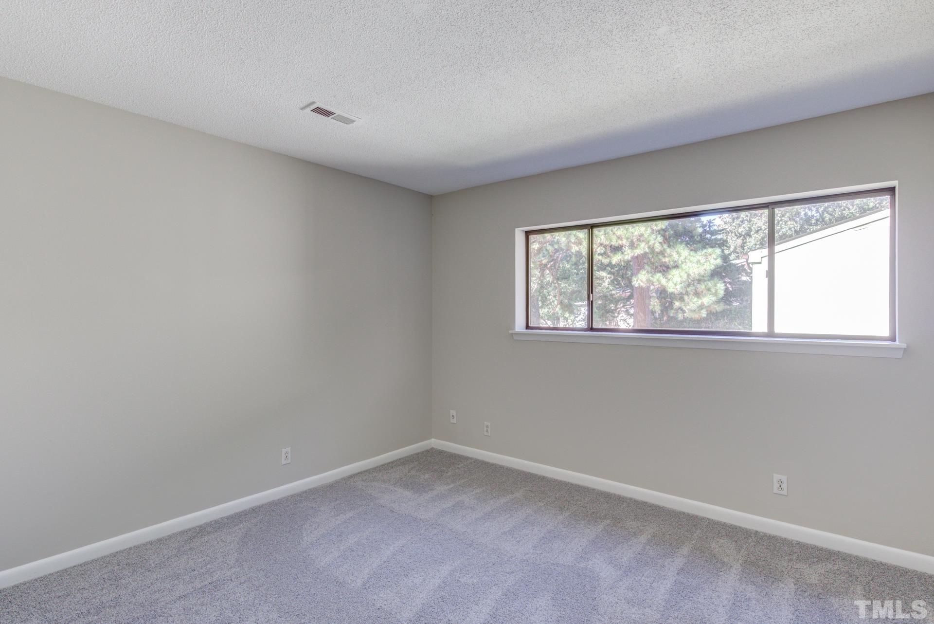 5062 Flint Ridge Place, Unit 5062 Raleigh, NC 27609 - Photo 19 of 23 an empty room with a window
