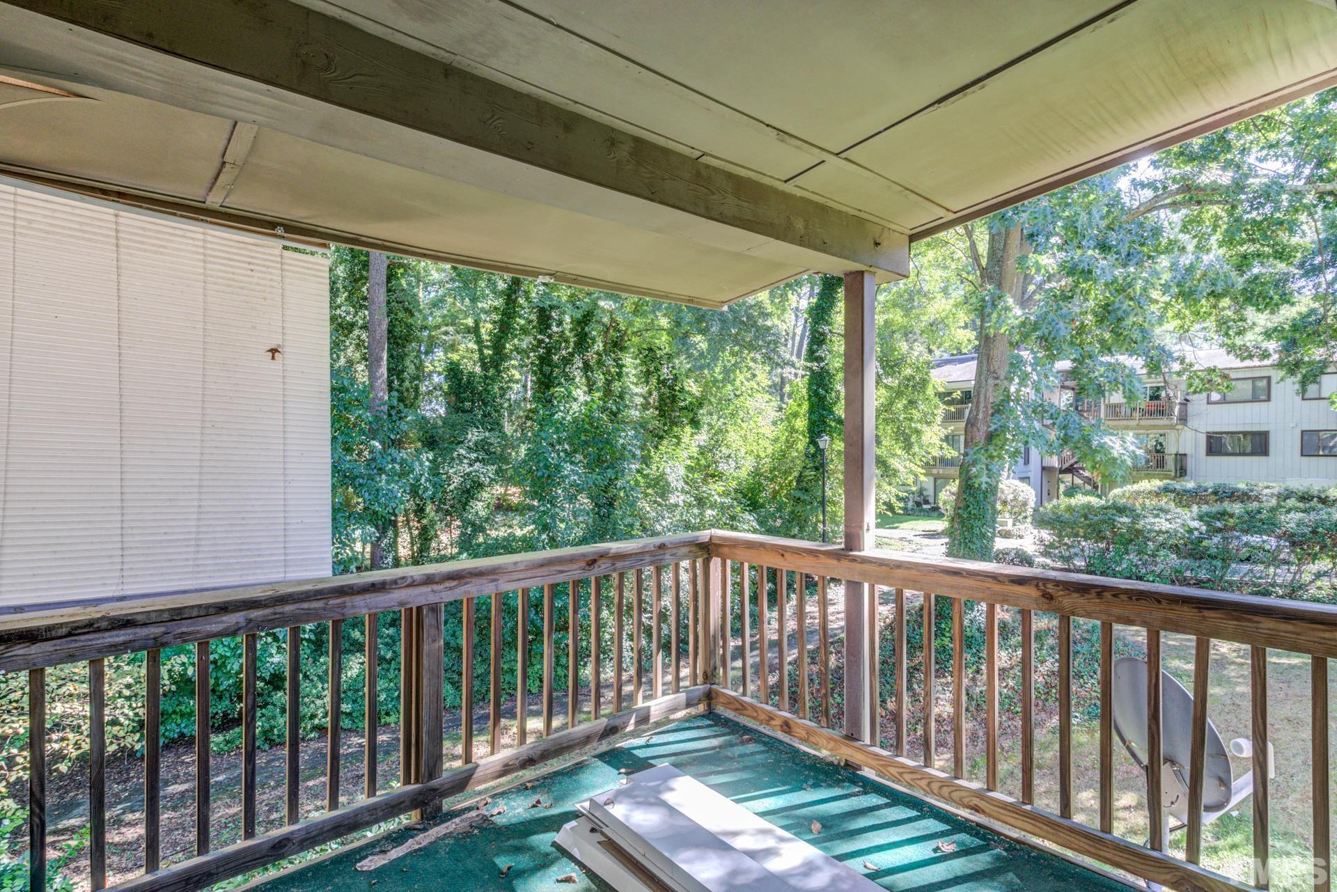 5062 Flint Ridge Place, Unit 5062 Raleigh, NC 27609 - Photo 23 of 23 a view of a balcony with wooden floor
