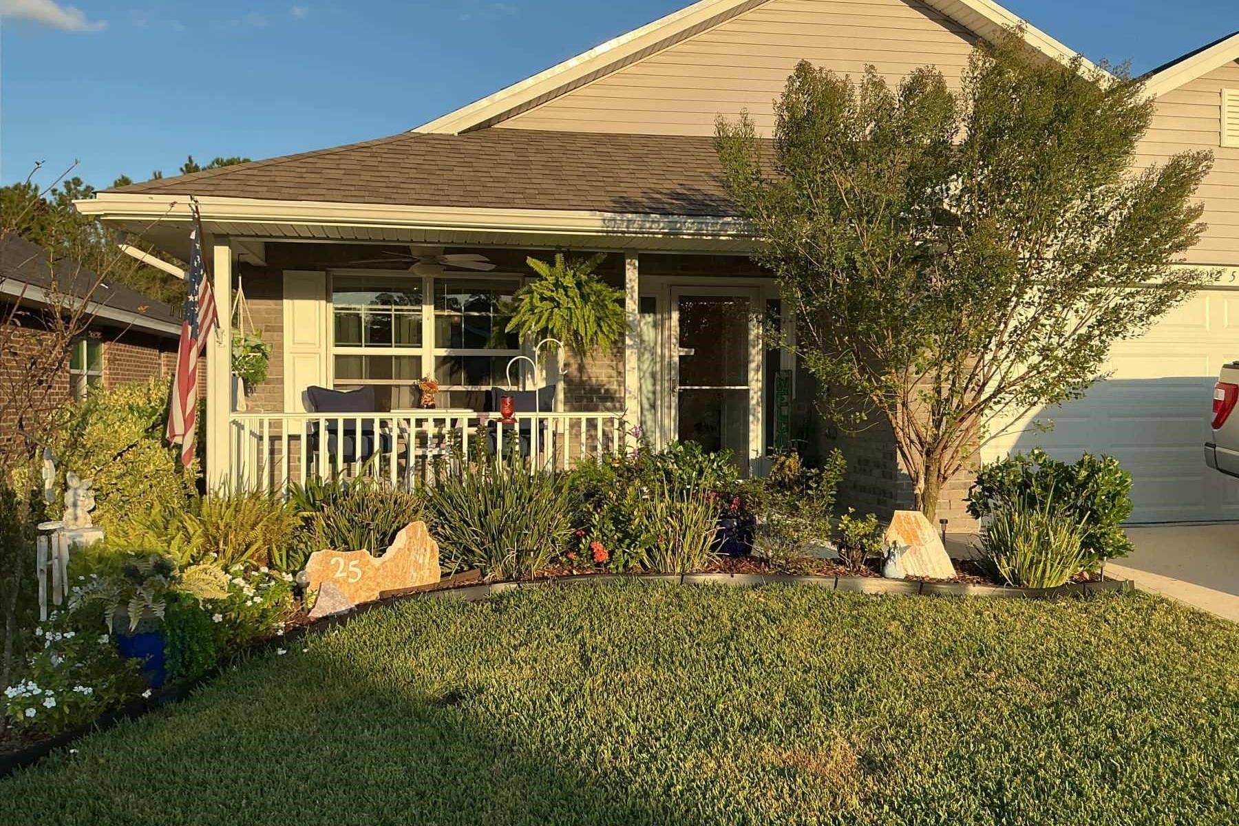 25 Rivertown Road Palm Coast, FL 32137 - Photo 29 of 40 front view of a house with a yard