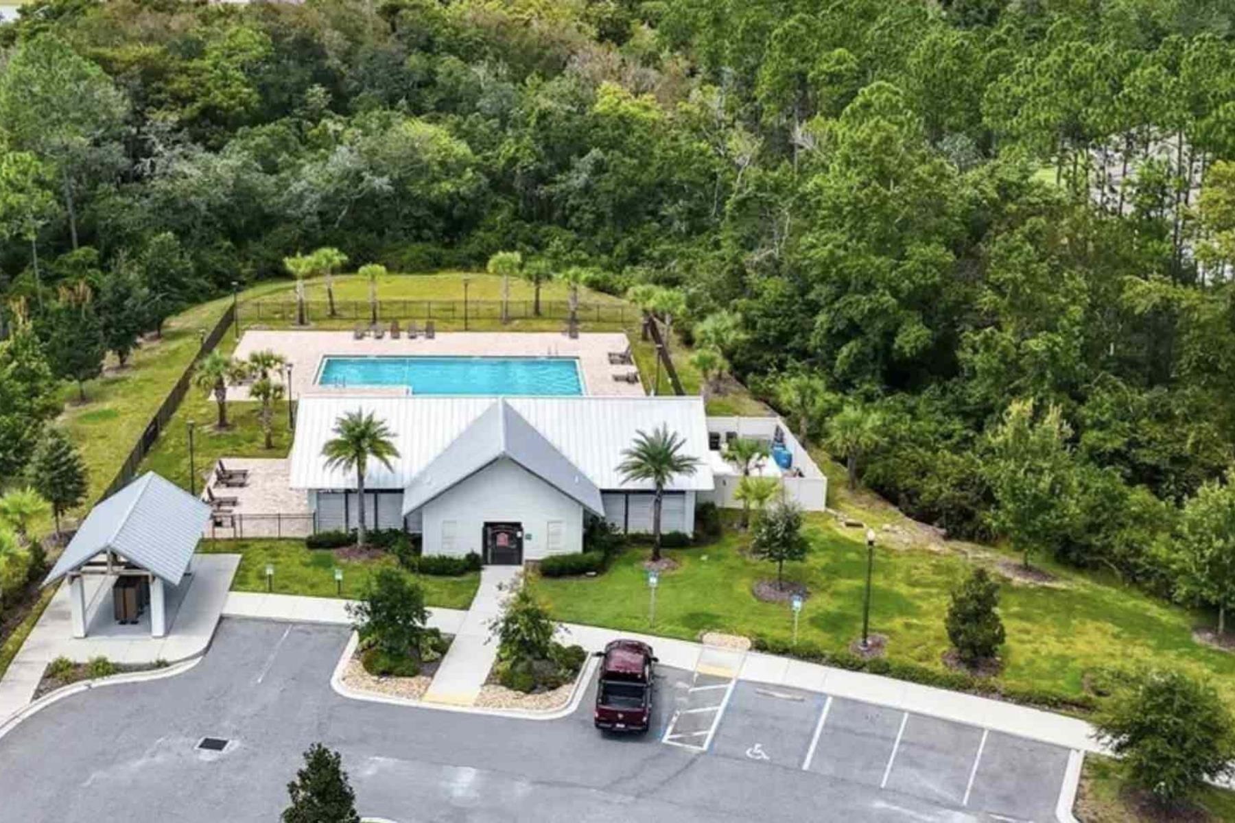 25 Rivertown Road Palm Coast, FL 32137 - Photo 34 of 40 an aerial view of a house with a garden
