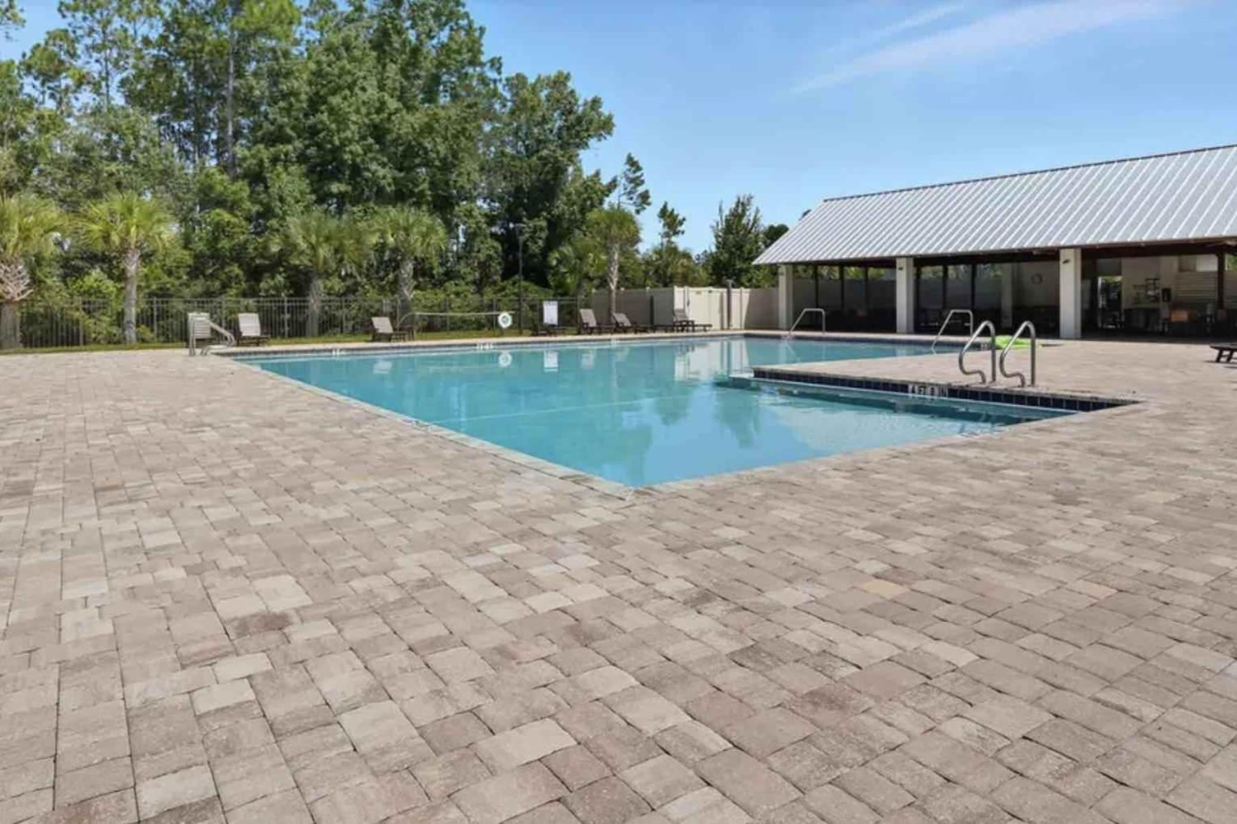 25 Rivertown Road Palm Coast, FL 32137 - Photo 37 of 40 a view of a swimming pool with an outdoor seating