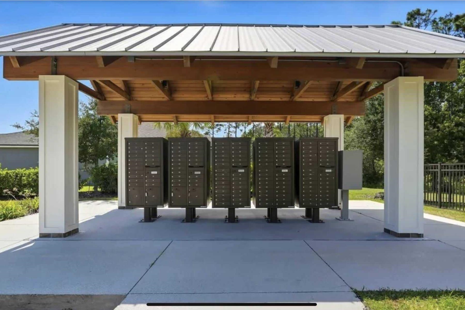 25 Rivertown Road Palm Coast, FL 32137 - Photo 40 of 40 a view of porch with a table and chairs under an umbrella