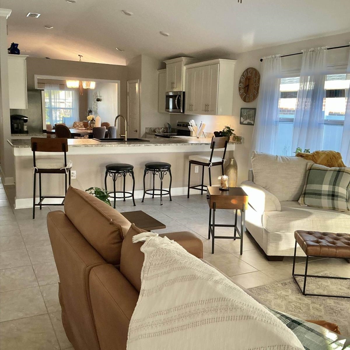 25 Rivertown Road Palm Coast, FL 32137 - Photo 10 of 40 a living room with furniture kitchen view and a wooden floor