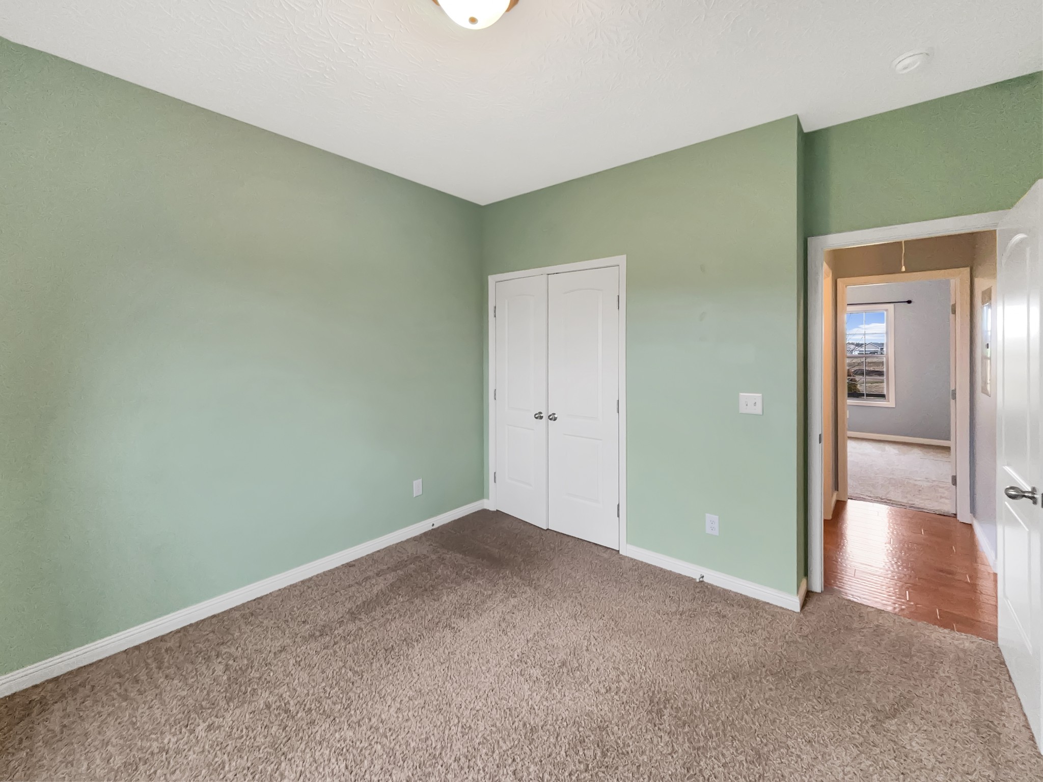 374 Cook Road Portland, TN 37148 - Photo 12 of 16 an empty room with wooden floor & windows