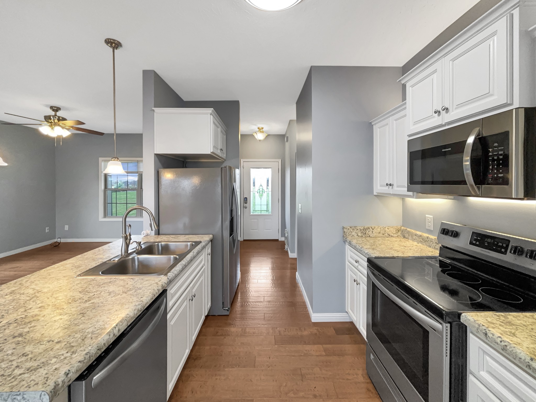 374 Cook Road Portland, TN 37148 - Photo 2 of 16 a kitchen with granite countertop counter space a sink stainless steel appliances and cabinets