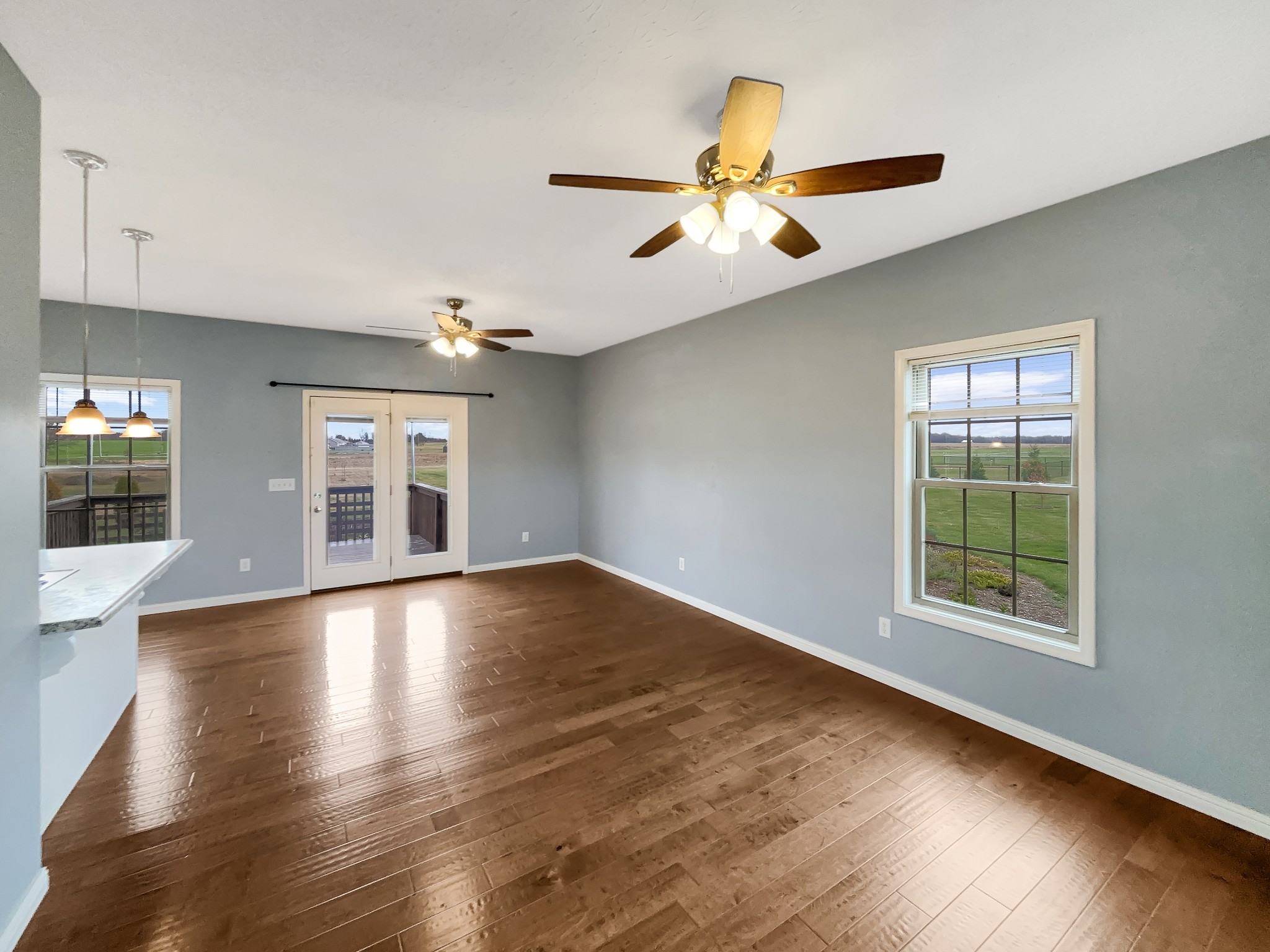 374 Cook Road Portland, TN 37148 - Photo 3 of 16 a view of an empty room with wooden floor and a window