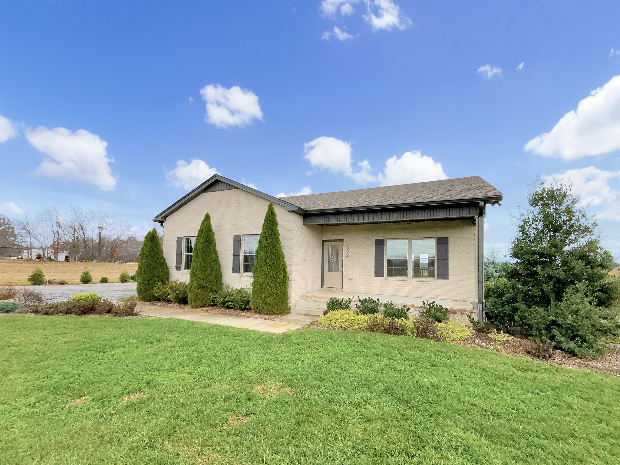 374 Cook Road Portland, TN 37148 - Photo 7 of 16 a view of a house with backyard and garden