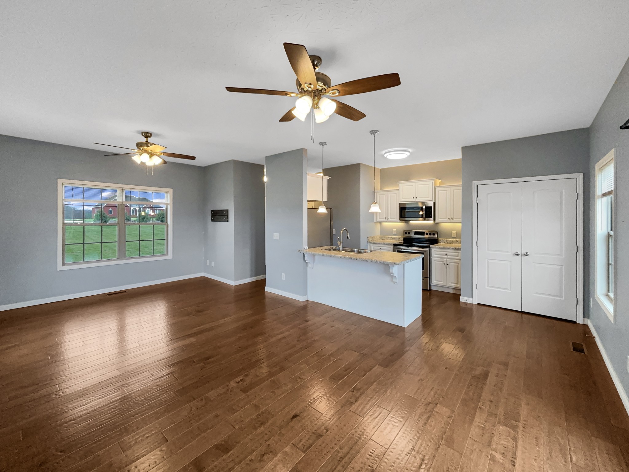 374 Cook Road Portland, TN 37148 - Photo 8 of 16 a view of an empty room with kitchen and a window