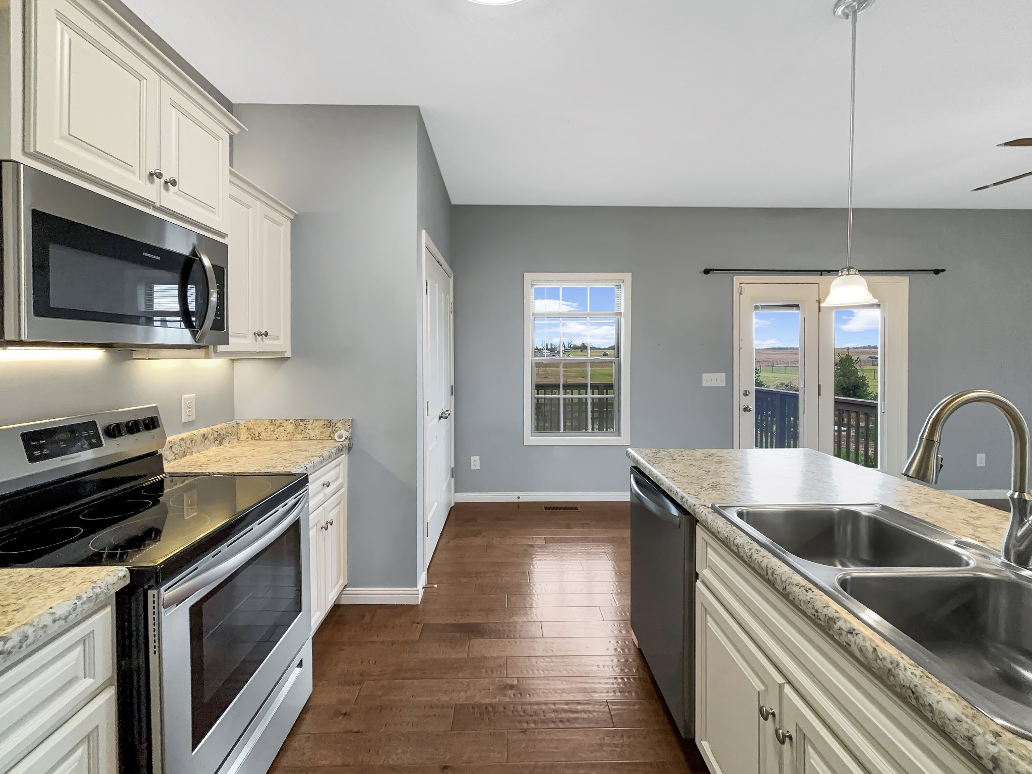 374 Cook Road Portland, TN 37148 - Photo 10 of 16 a kitchen with stainless steel appliances granite countertop a sink and stove