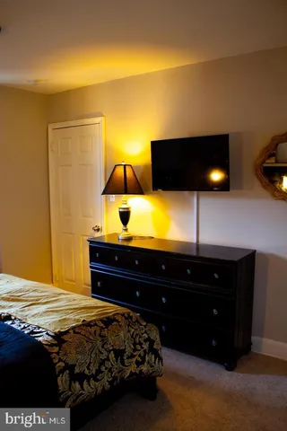a living room with furniture and flat screen tv