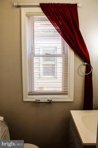 a view of a kitchen that has a window