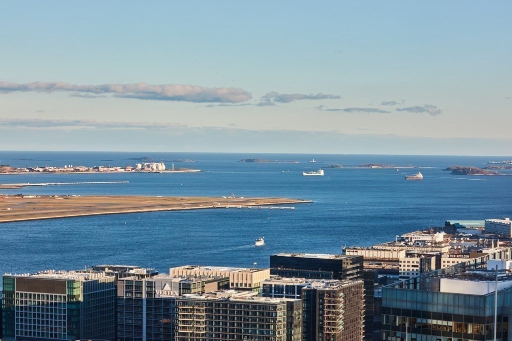 a view of a city with an ocean