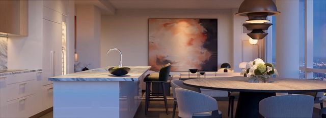 a view of a livingroom with furniture and floor to ceiling window