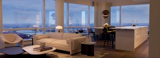 a living room with furniture a table and chair