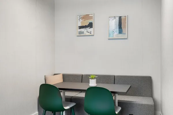 a living room with furniture and a chair