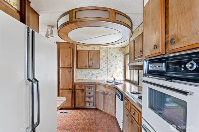 a bathroom with a granite countertop sink a vanity and a mirror
