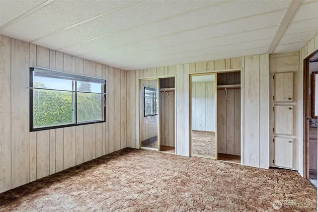 a view of a bedroom with closet area