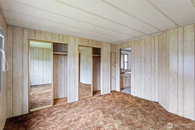 a view of a bedroom with closet and cabinet