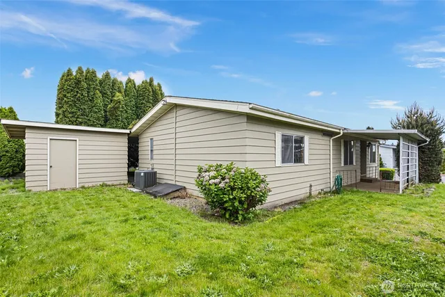 a view of a garden with plants and a fountain