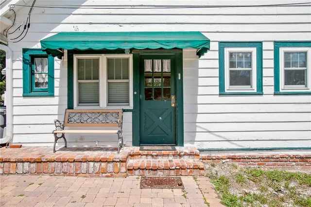 a view of a yard with a house and large tree
