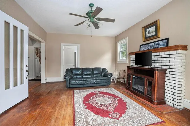 a living room with furniture flat screen tv and a fireplace